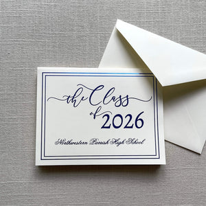 Graduation announcement card with blue foil design for 'the Class of 2026' and an envelope on a gray textured background.