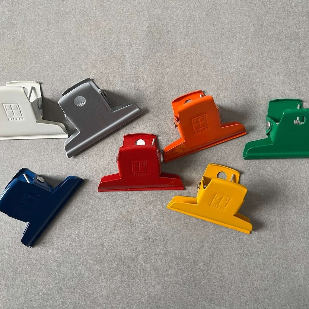 Set of colorful Ellepi paper clips on a gray background