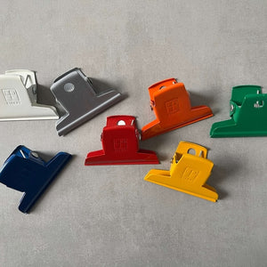 Set of colorful Ellepi paper clips on a gray background