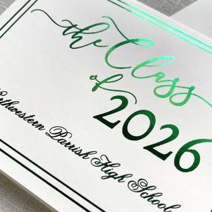 Graduation announcement card with green foil design for 'the Class of 2026' on a gray textured background.