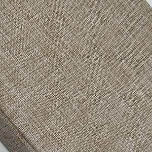 Close-up of textured brown fabric with a subtle pattern
