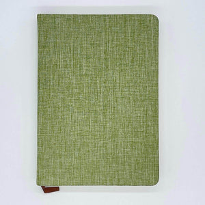 Green textured notebook on a white background