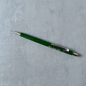 Green Pentel Sharp mechanical pencil on a gray background