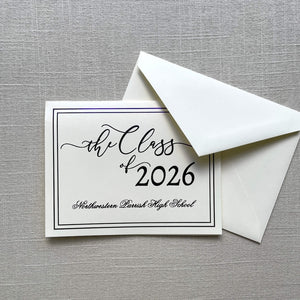Graduation announcement card with purple foil design for 'the Class of 2026' and an envelope on a gray textured background.