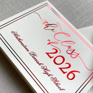 Graduation announcement card with red foil design for 'the Class of 2026' on a gray textured background.