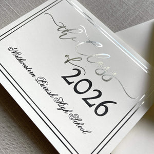 Graduation announcement card with silver foil design for 'the Class of 2026' on a gray textured background.
