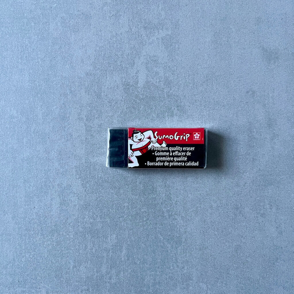 SumoGrip block eraser on a gray background