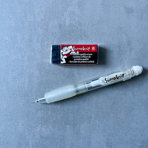 SumoGrip mechanical pencil and block eraser on a gray surface
