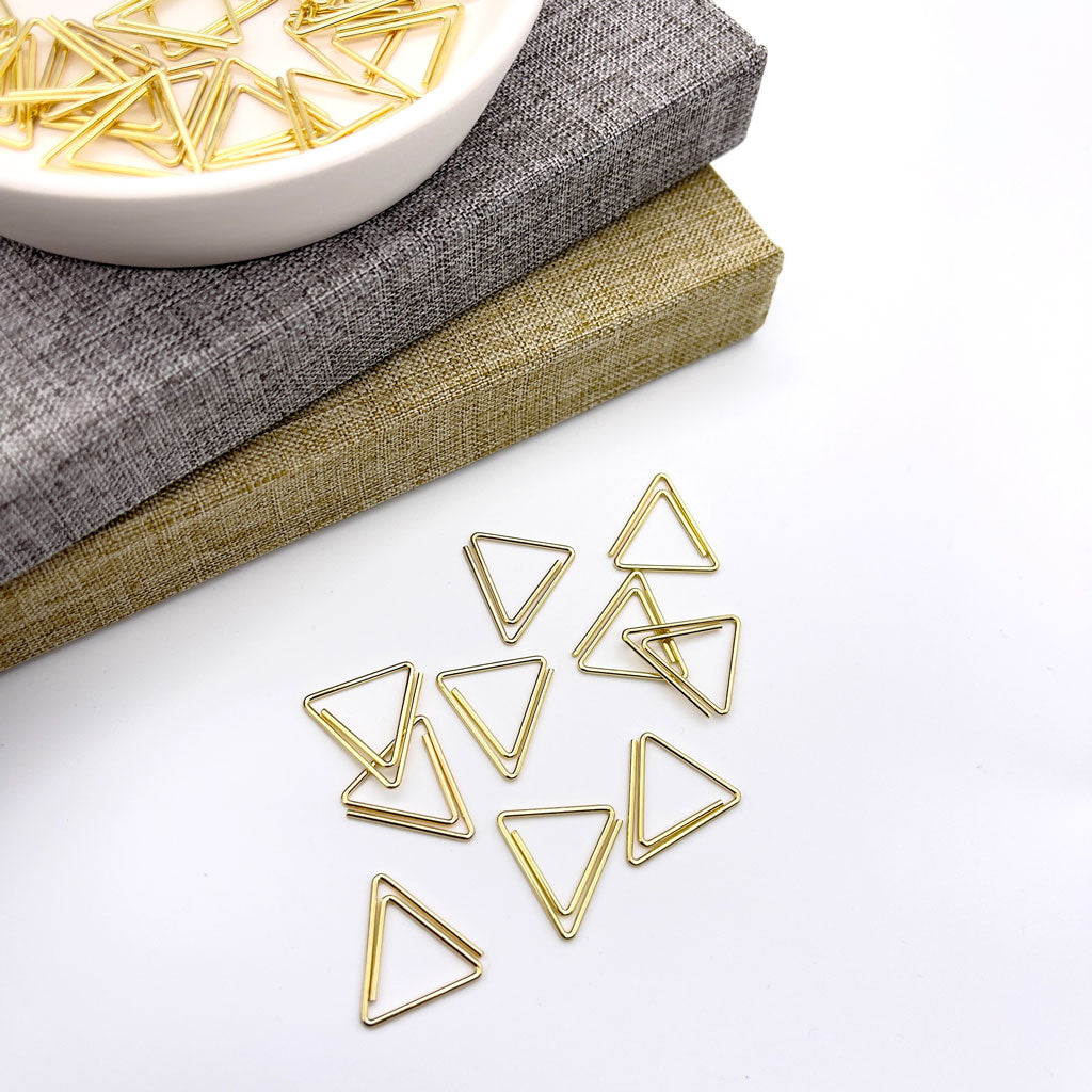 gold triangle shape paper clips
